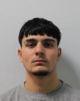 Boat migrant admits murdering shop worker